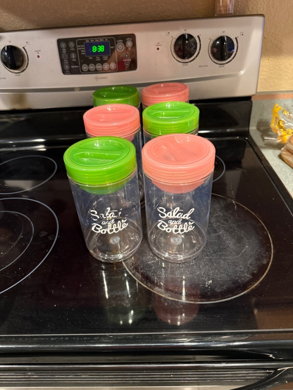 Set of Clear Salad and Bottle Containers with Pink and Green Lids